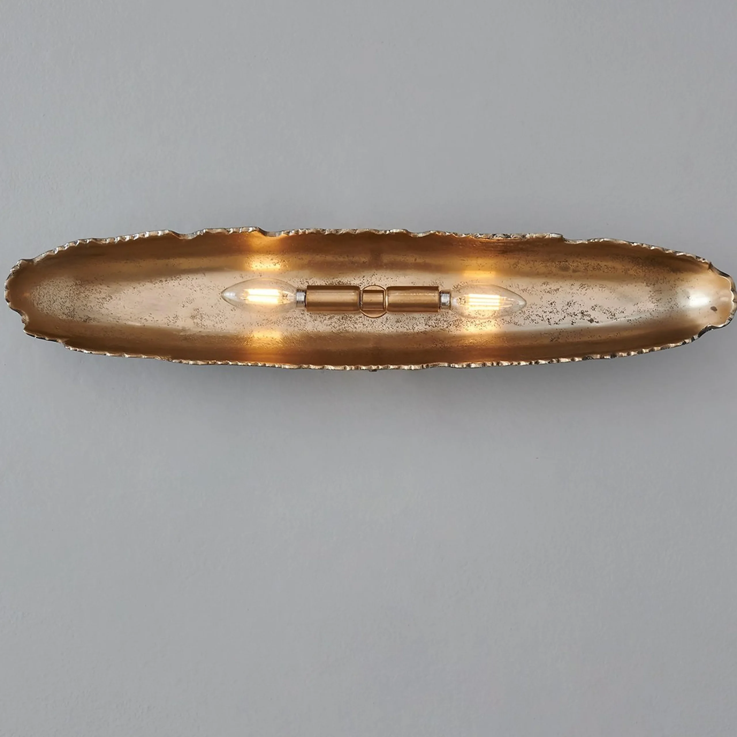 Oumaumau Sconce