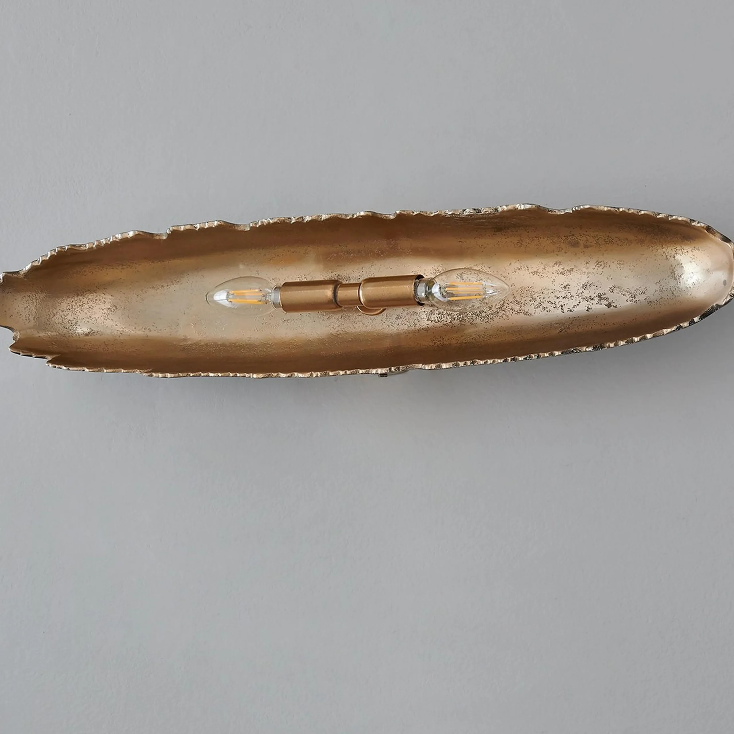 Oumaumau Sconce